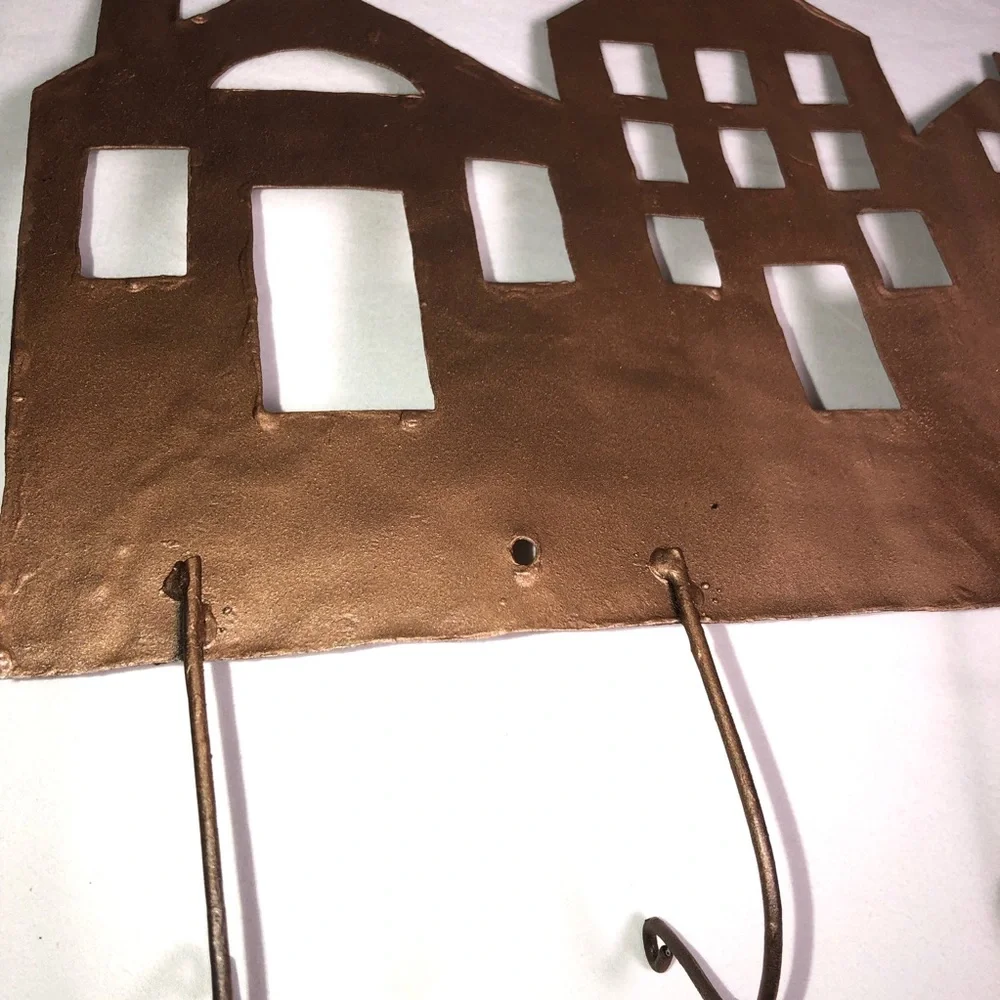 Copper painted metal house wall hanger with hooks, pre-owned